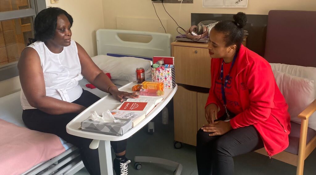 Nothuba with a patient as part of her volunteering.